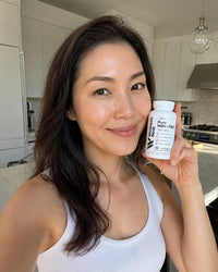 Verified customer holding bottle - kitchen
