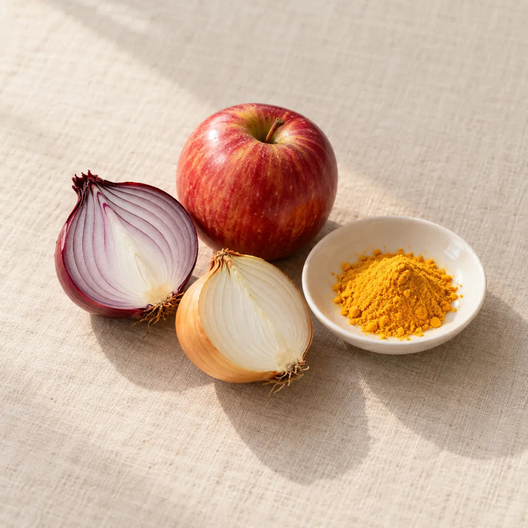 Quercetin: yellow powder in a small dish beside onions and an apple (illustration)